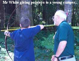 Mr White giving pointers to a young camper.