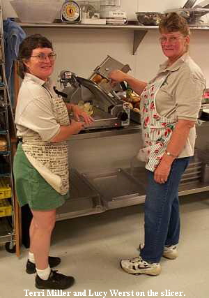 Terri Miller and Lucy Werst on the slicer.